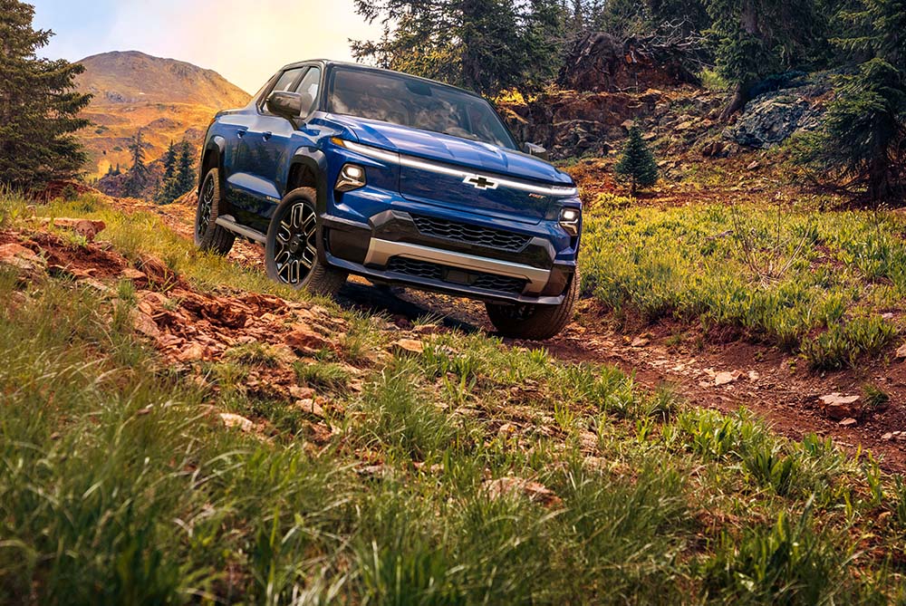 Striking blue Chevrolet driving off road