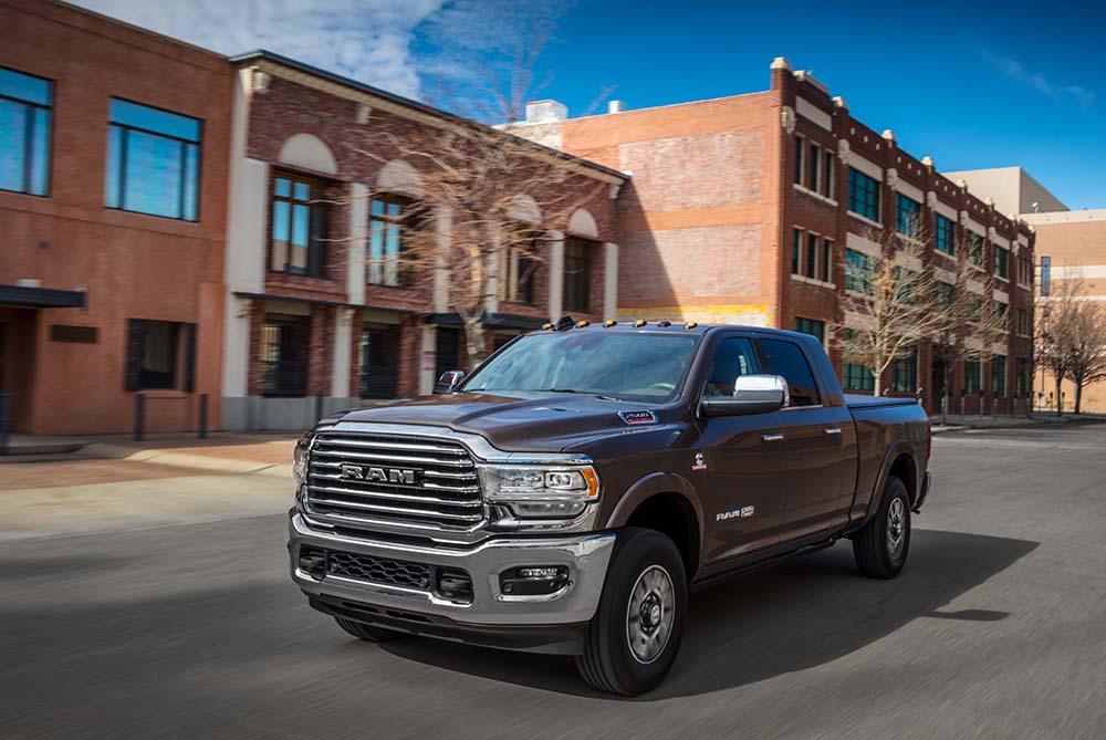 RAM pickup driving through the city