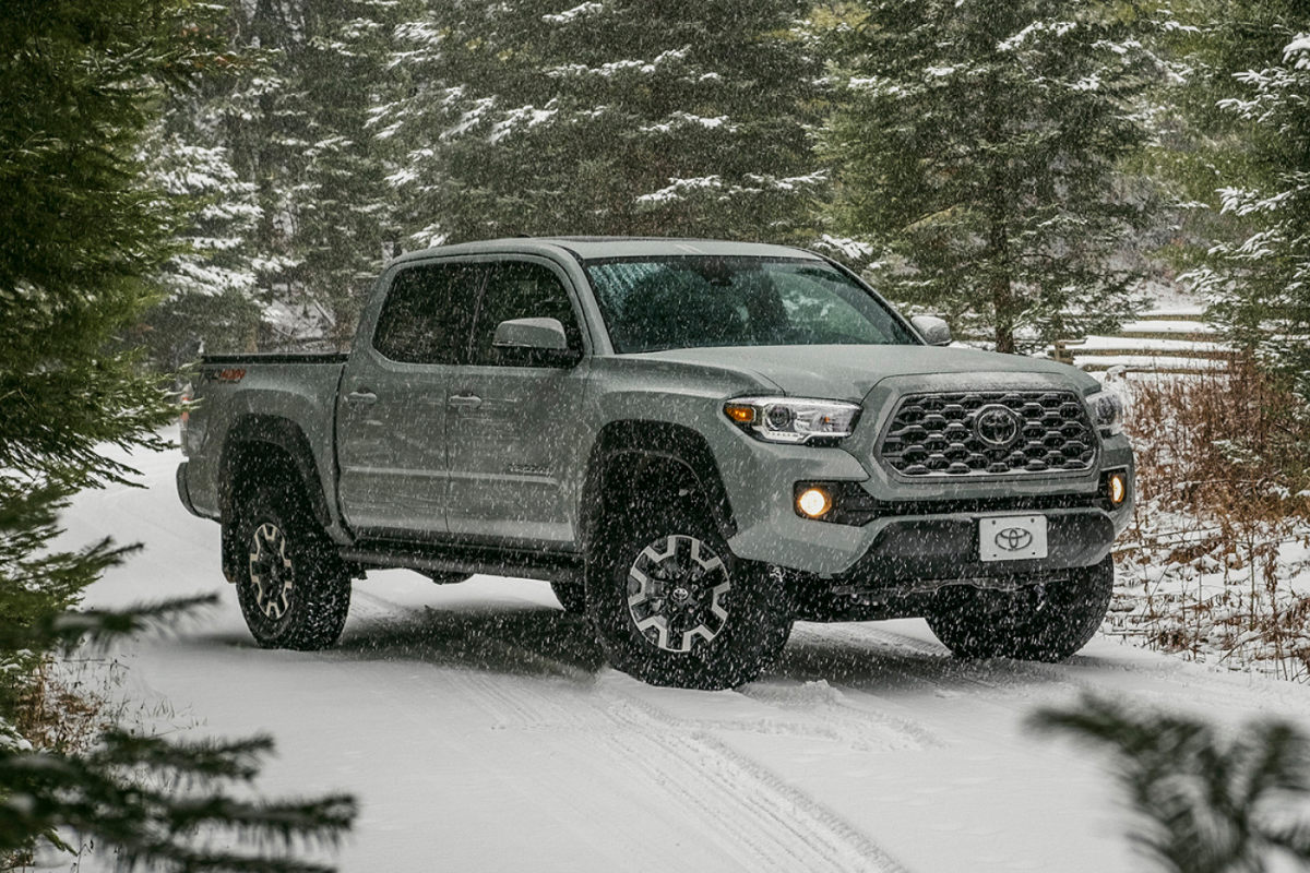 Toyota Tacoma parked in a snowy forest