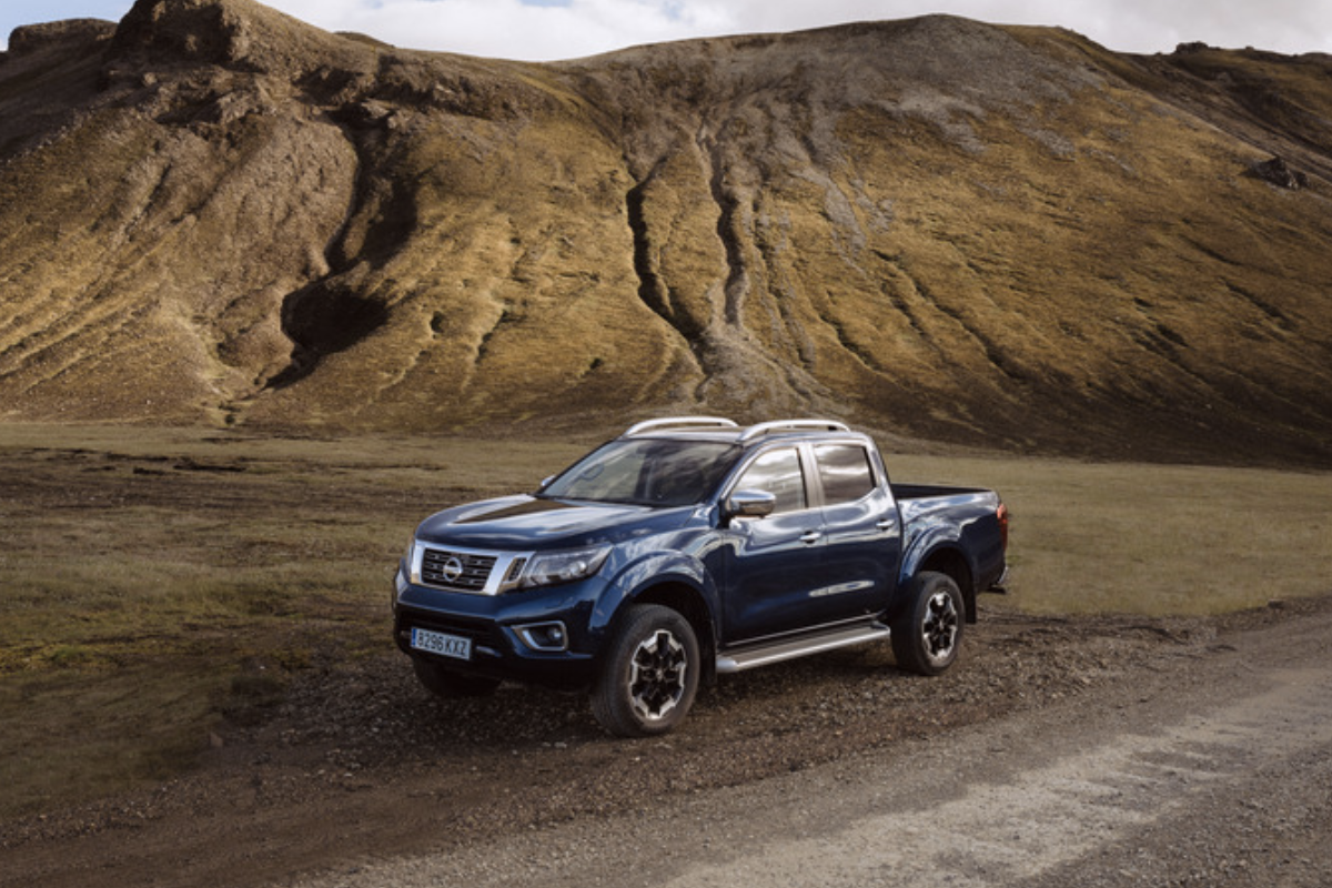 Nissan Navara parked alongside a mountain range