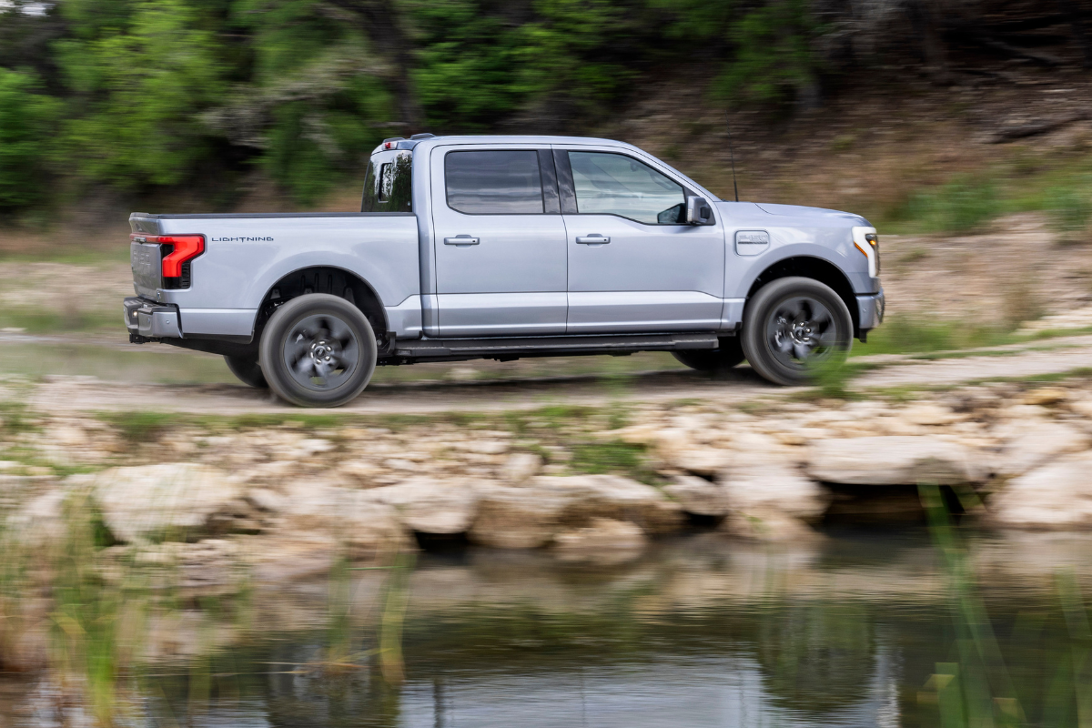 Ford F-150 driving along a lake