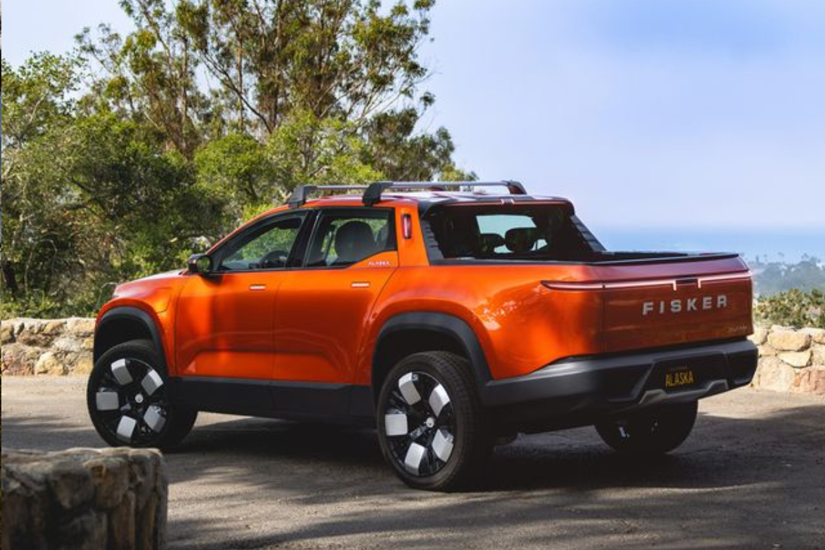 The rear of an orange Fisker Alaska 